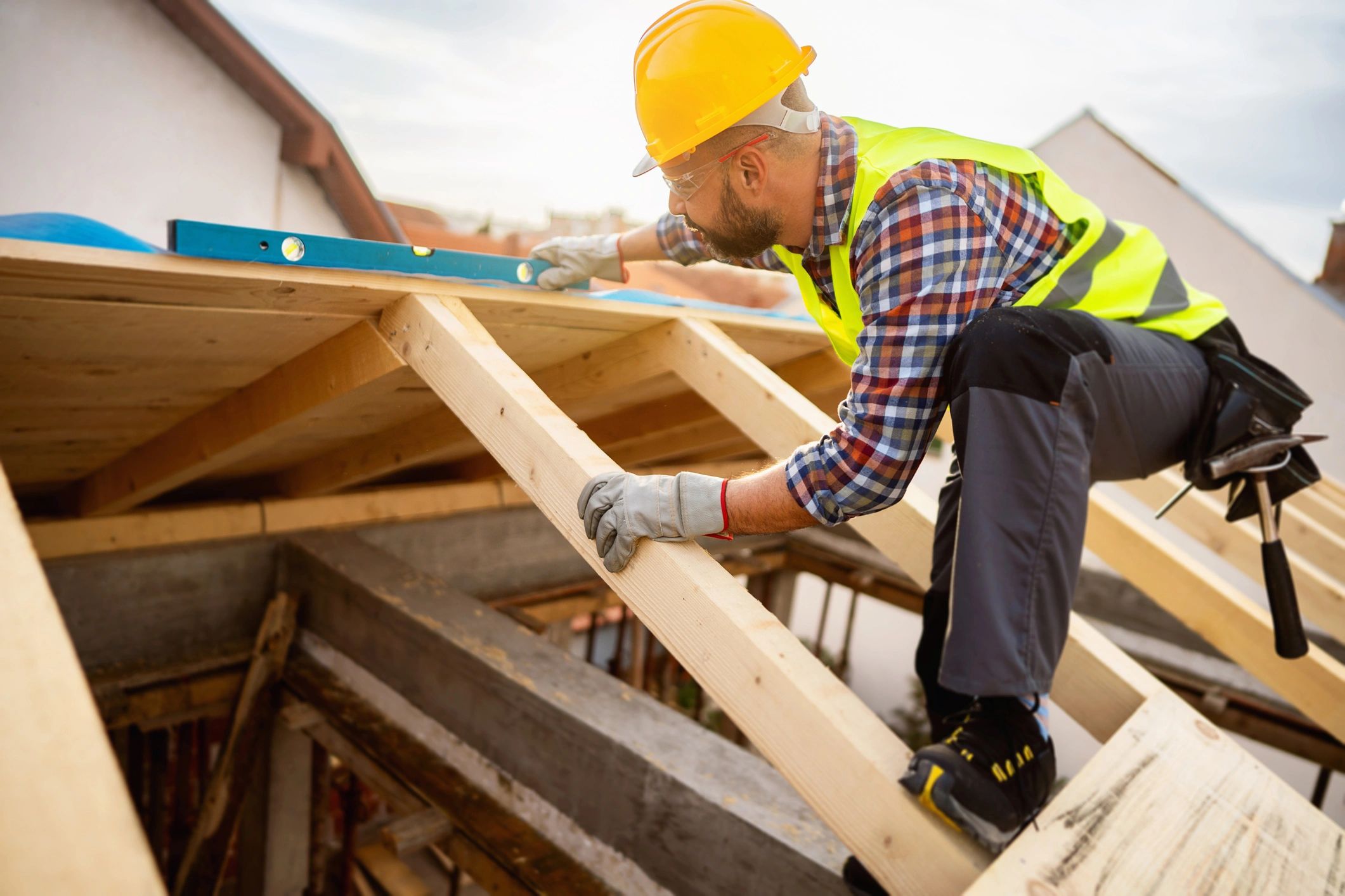 Inspector working on a roof structure during a home inspection